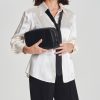 Naisille tehty tiikeri-printtinen clutch
